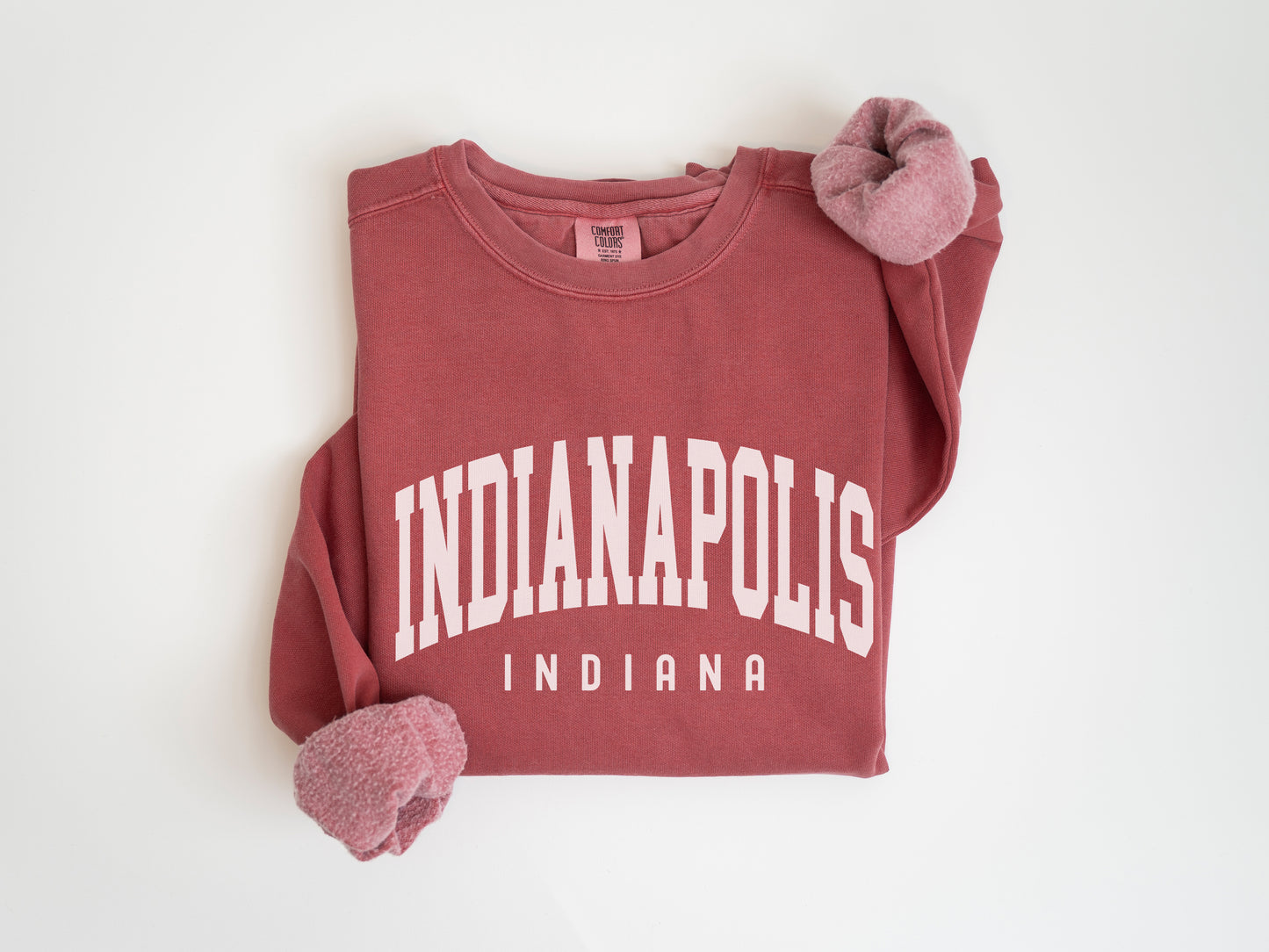 a red shirt with the word indianapolis on it