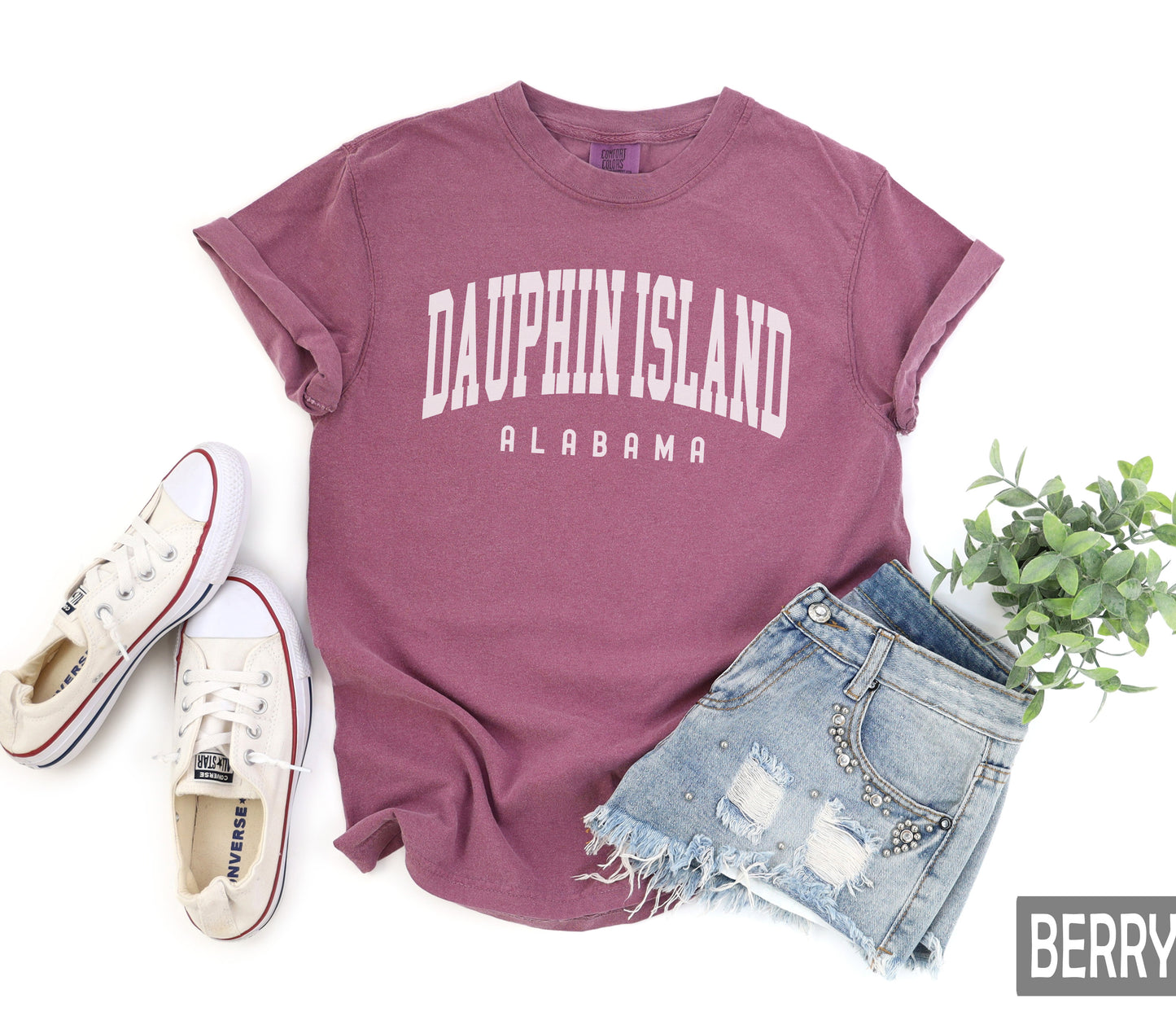 a t - shirt with the word daufrin island on it next to a