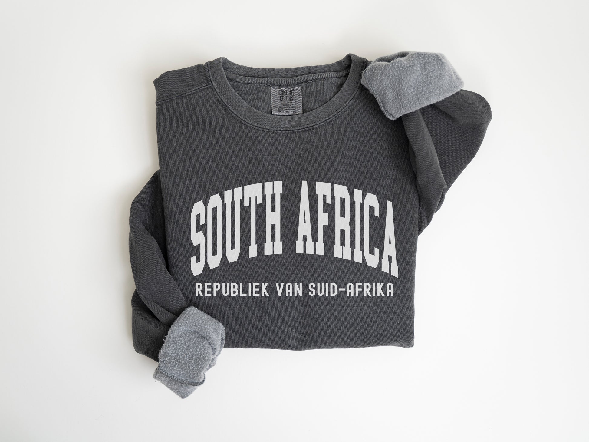 a black shirt with a white south africa on it