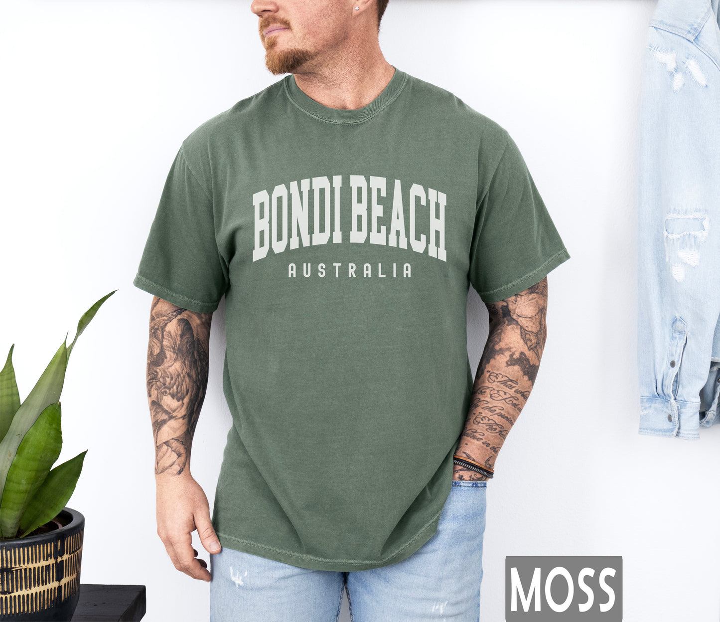 a man wearing a shirt that says bondi beach australia