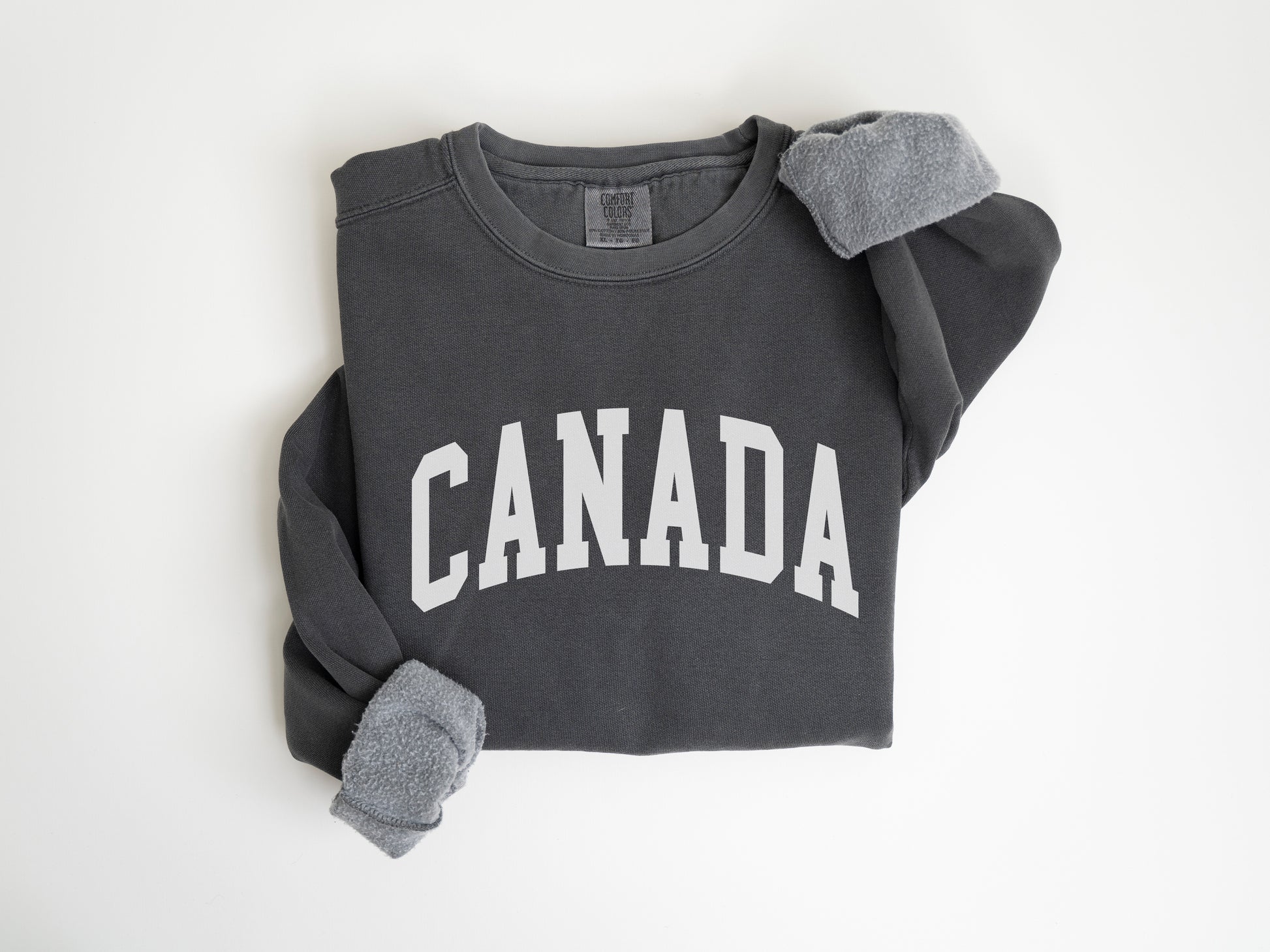 a sweatshirt with the word canada printed on it