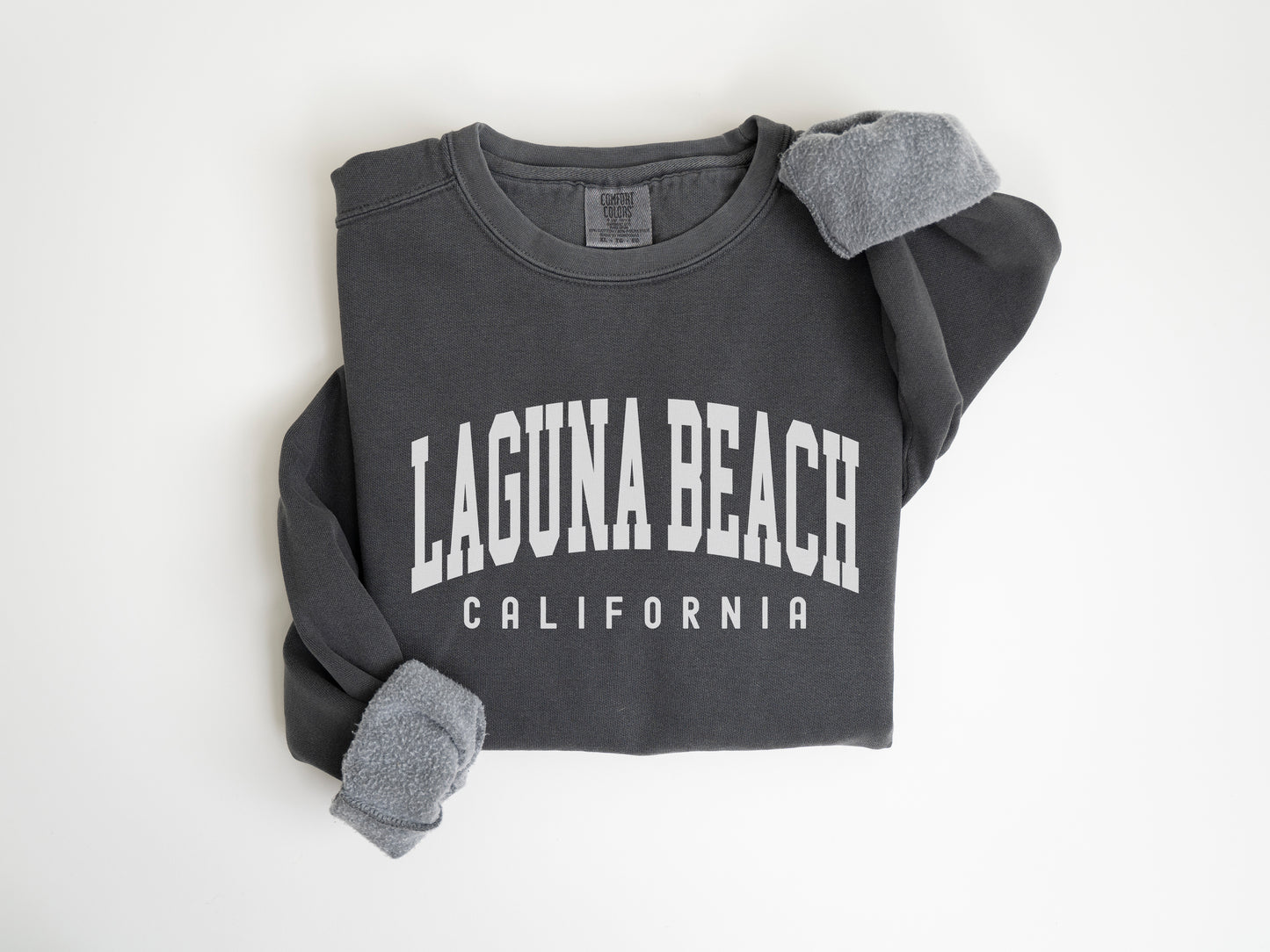 a long sleeved shirt with the word laguna beach on it