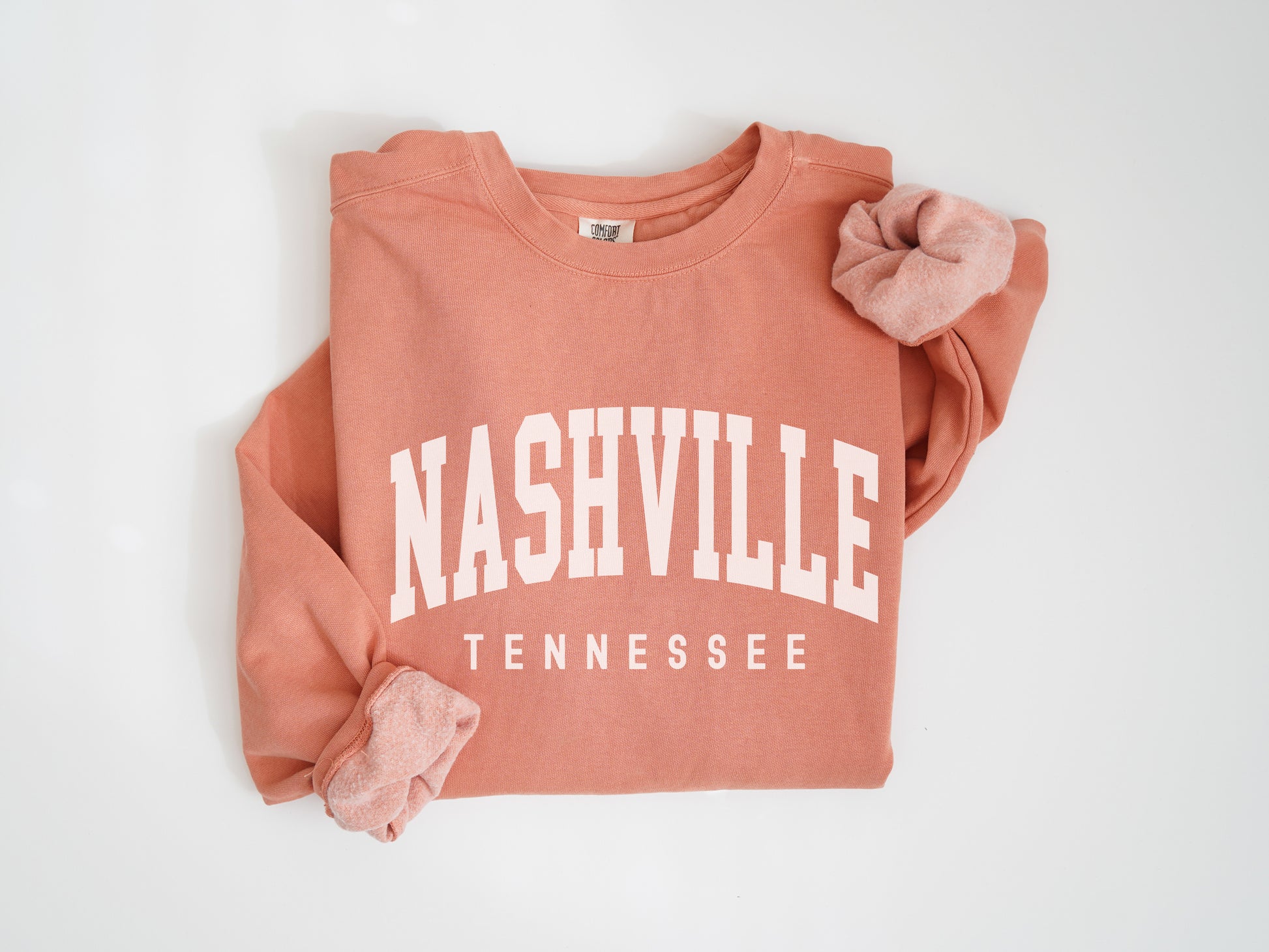 a pink sweatshirt with the words nashville on it