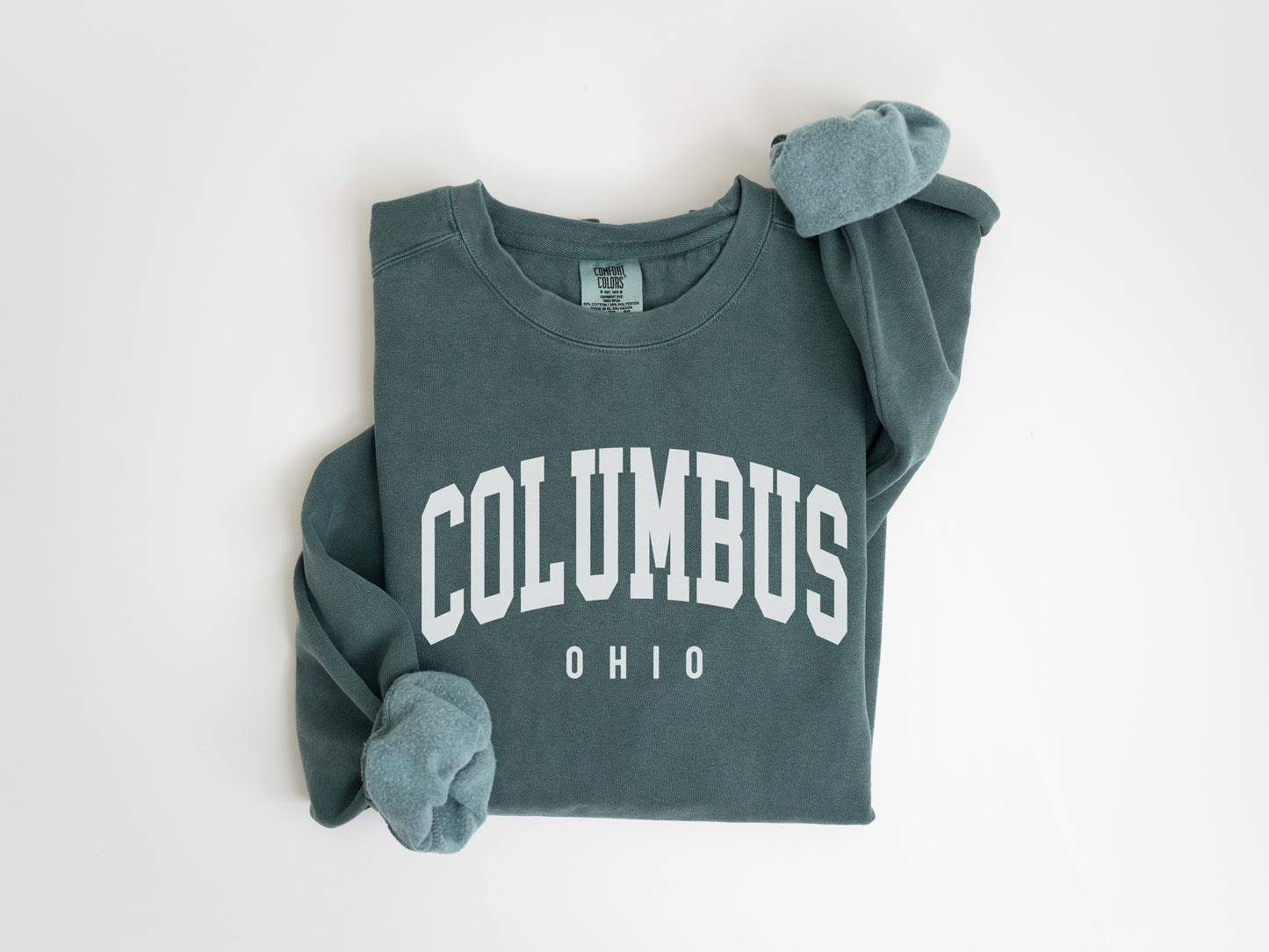 a green sweatshirt with the word columbus on it