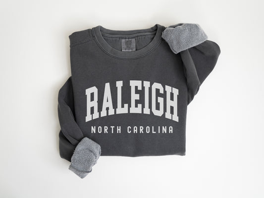 a sweatshirt with the word raleigh on it