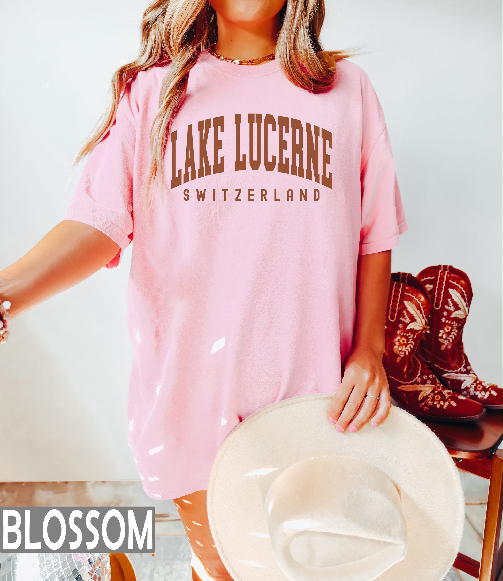 a woman wearing a pink lake lucene t - shirt