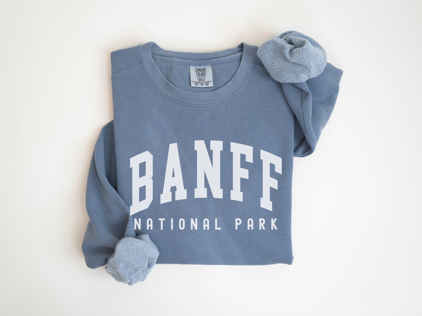 a blue shirt with the banff national park on it