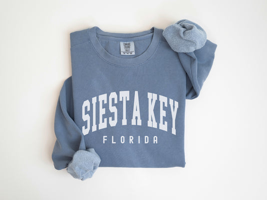 a blue sweatshirt with the word siestta key on it