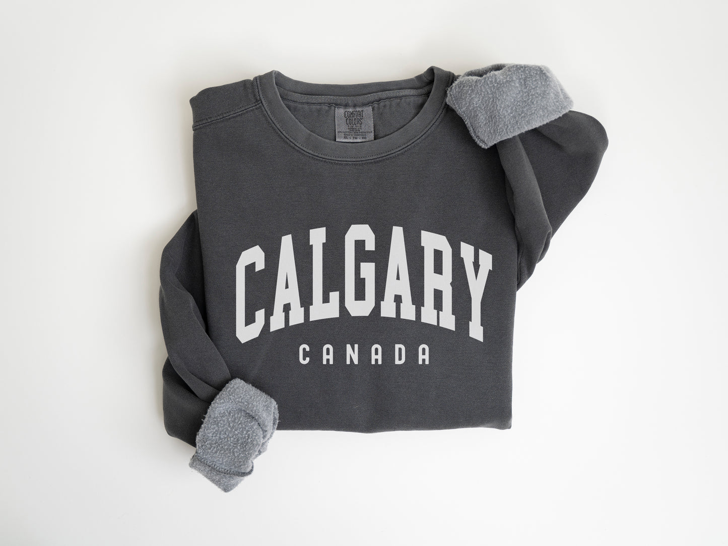 a gray sweatshirt with the word calgary printed on it