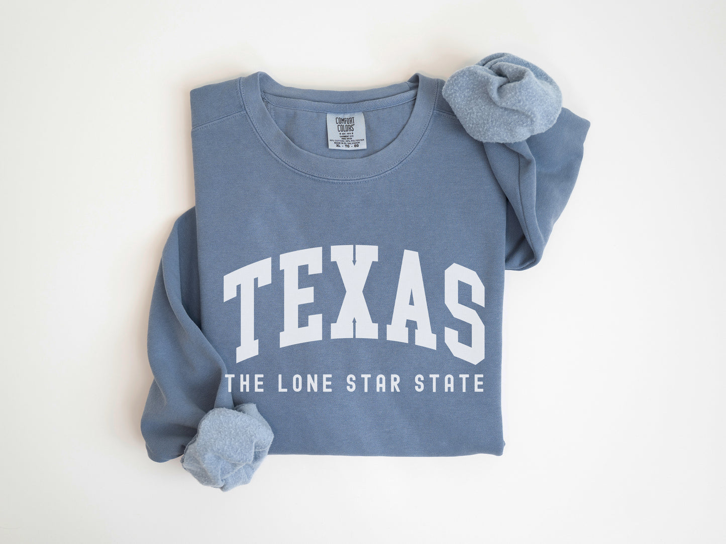 a blue shirt with the word texas on it