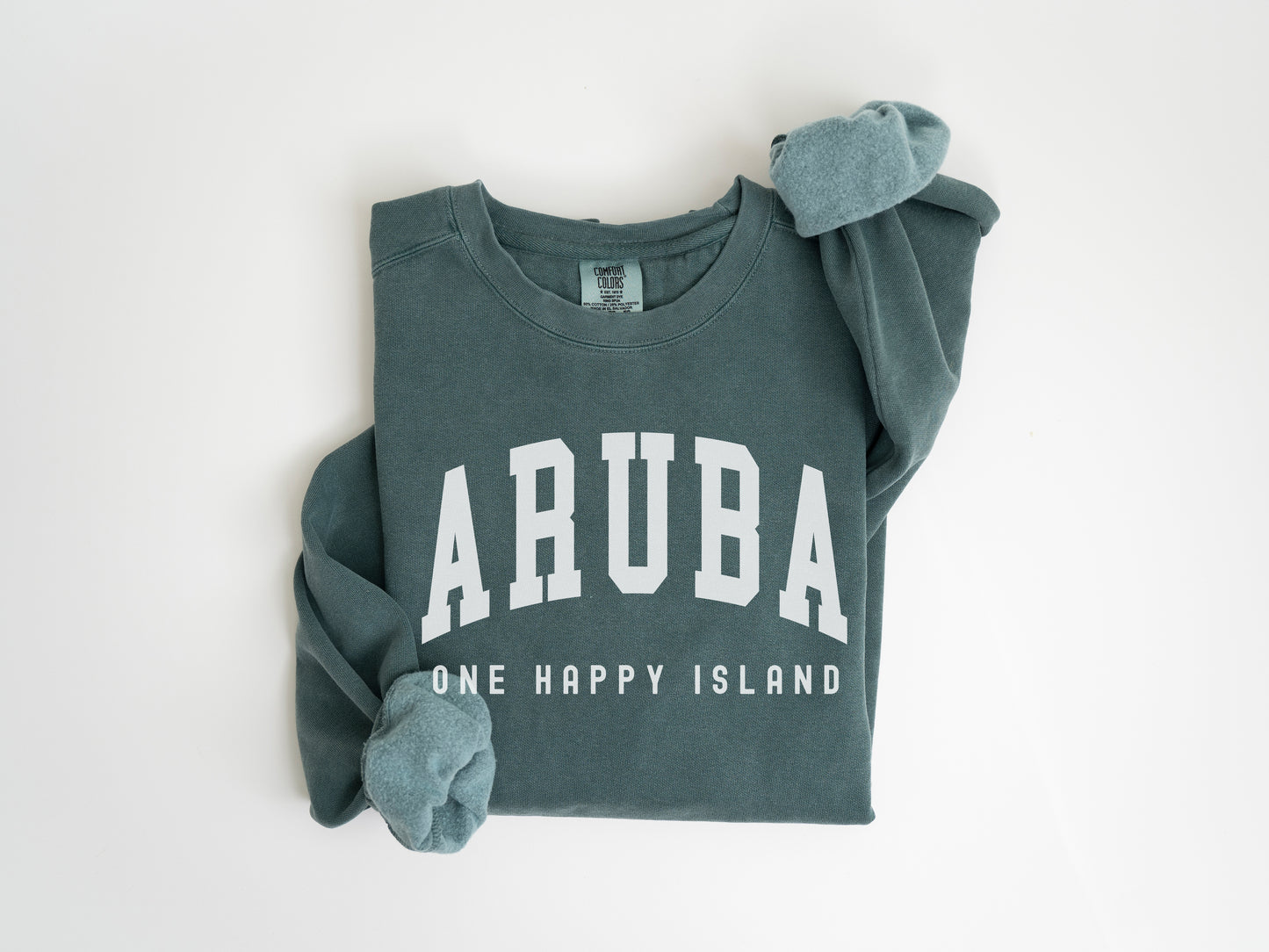 a green shirt with the word arubaa on it