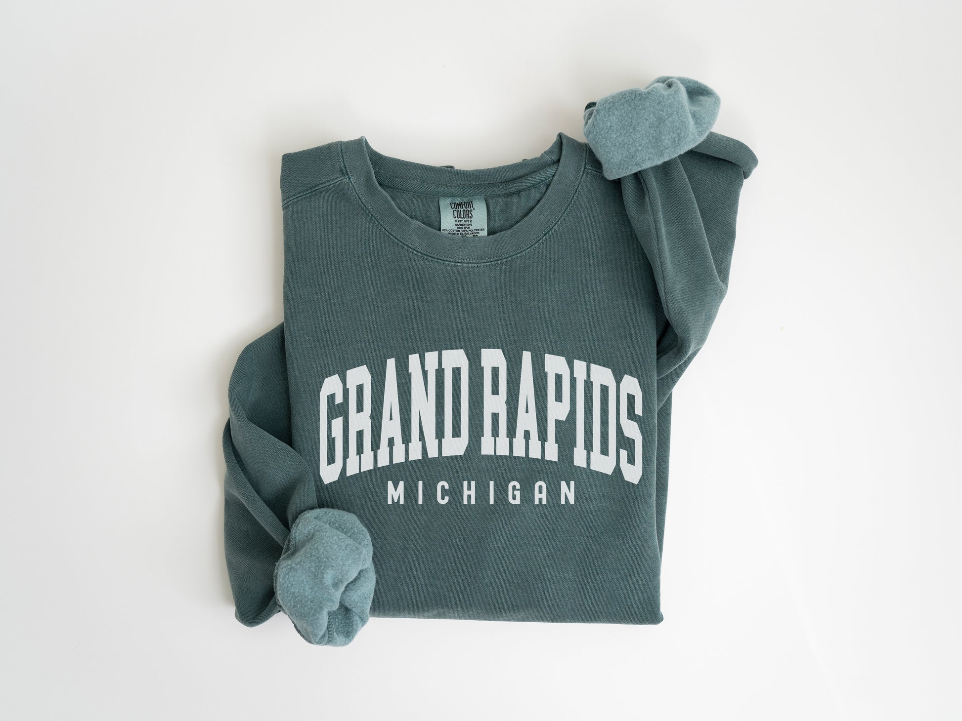 a green sweatshirt with the words grand rapids on it