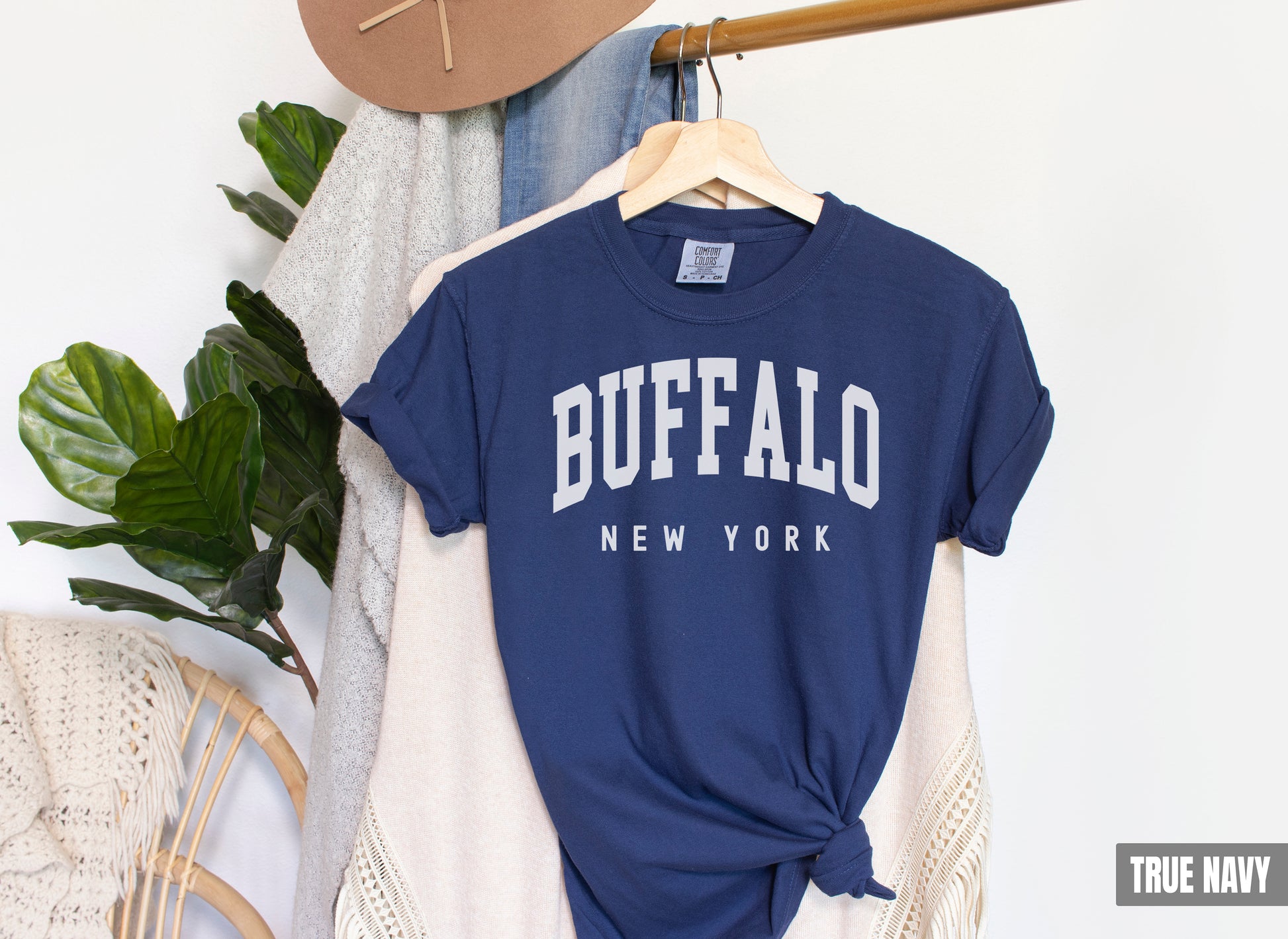 a blue buffalo new york t - shirt hanging on a rack