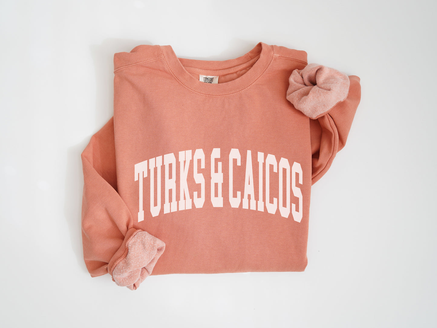 a pink sweatshirt with the words turns & cacios on it