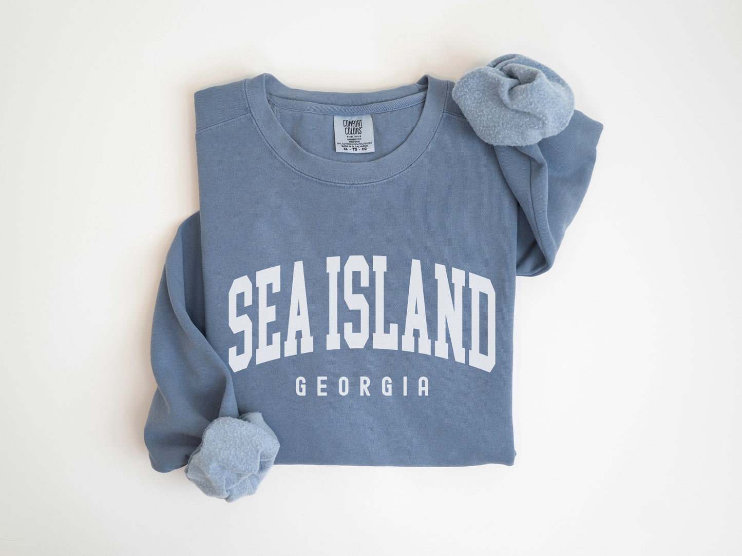 a blue shirt with the word sea island on it