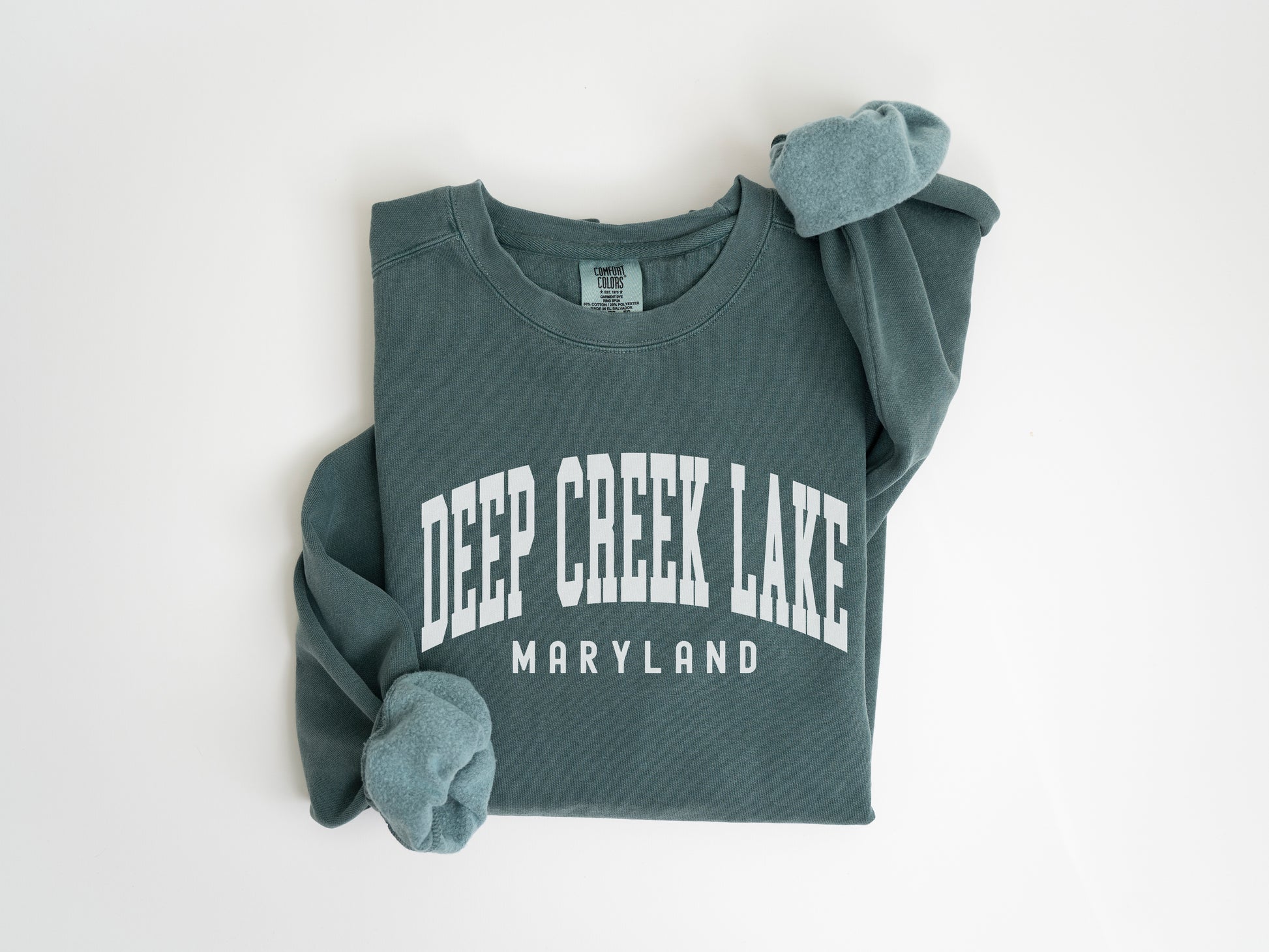 a green shirt with the words deep creek lake on it