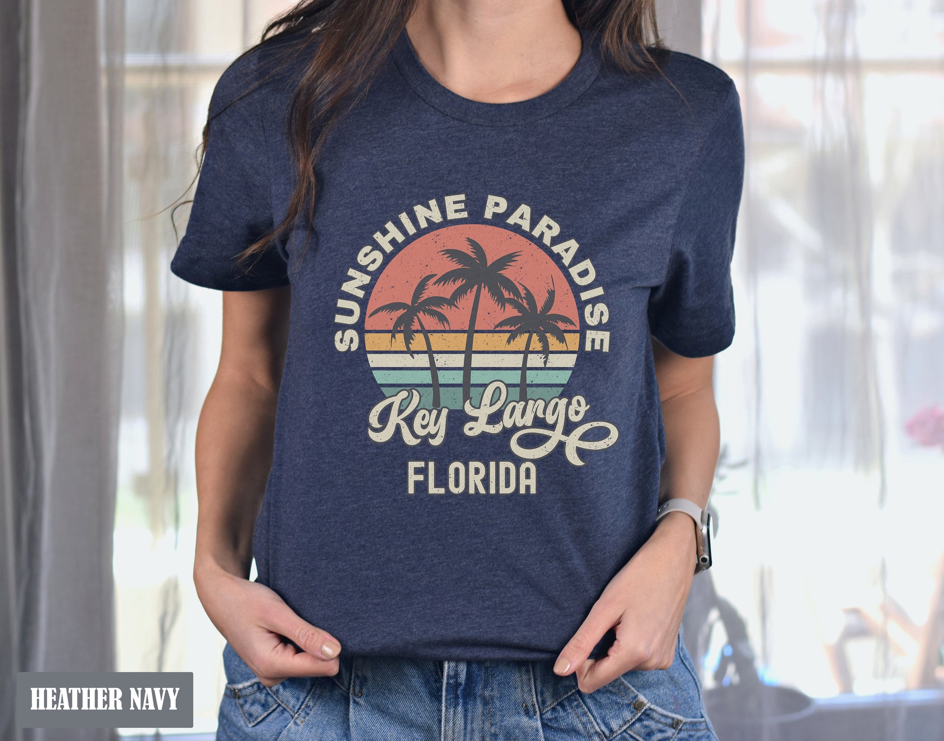 a woman wearing a blue shirt that says sunshine paradise key largo