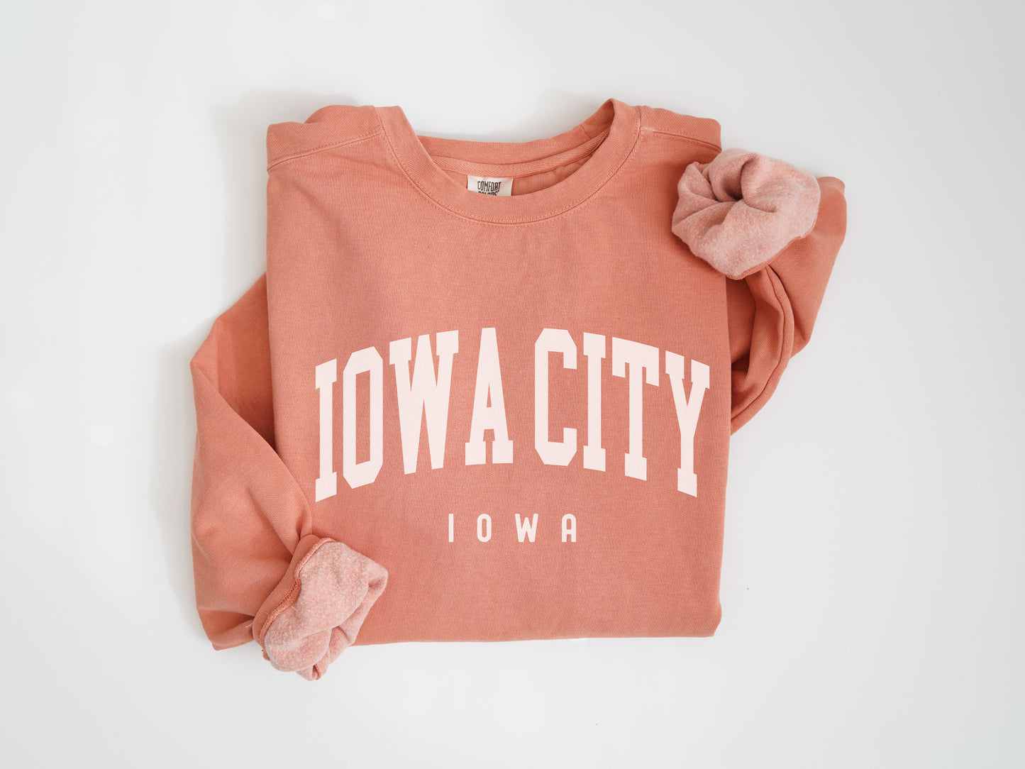 a pink sweatshirt with the words iowa on it