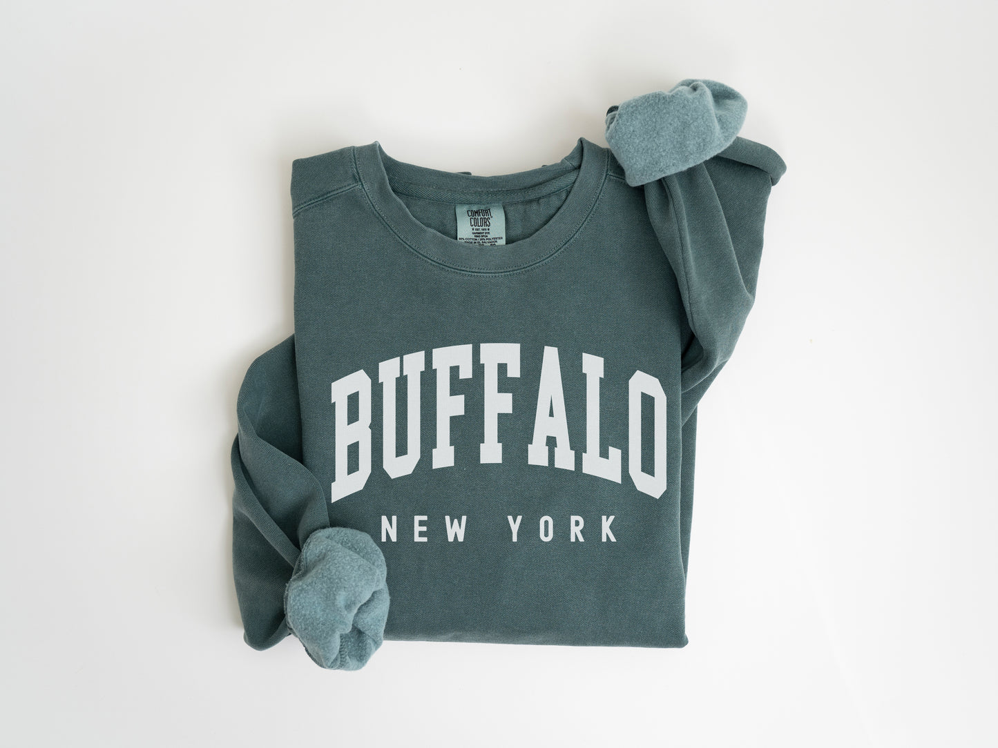 a green sweatshirt with the word buffalo on it