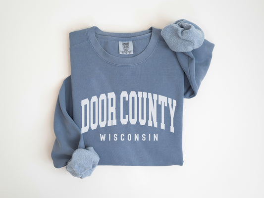 a blue shirt with the words door county on it