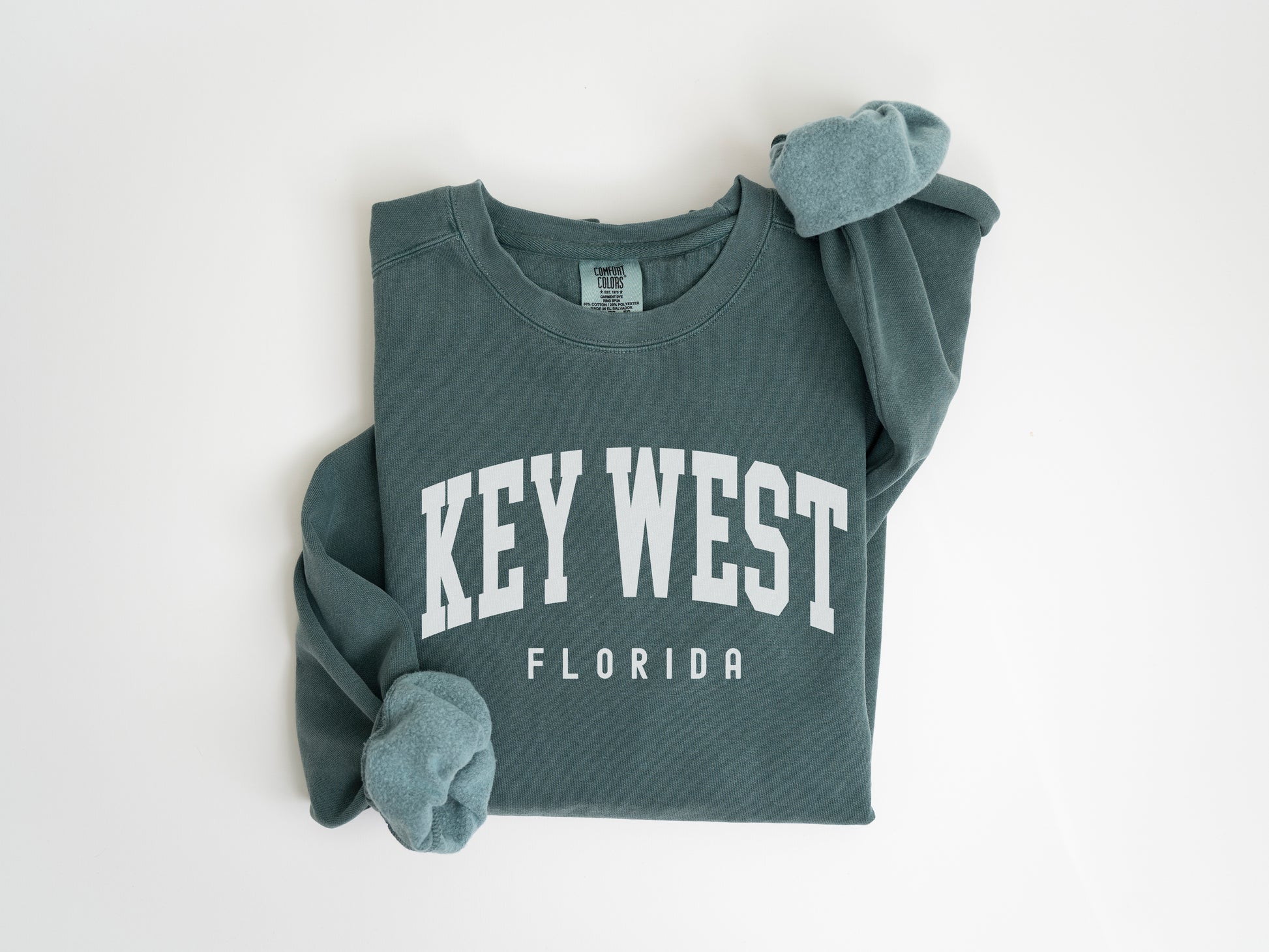 a green sweatshirt with key west on it