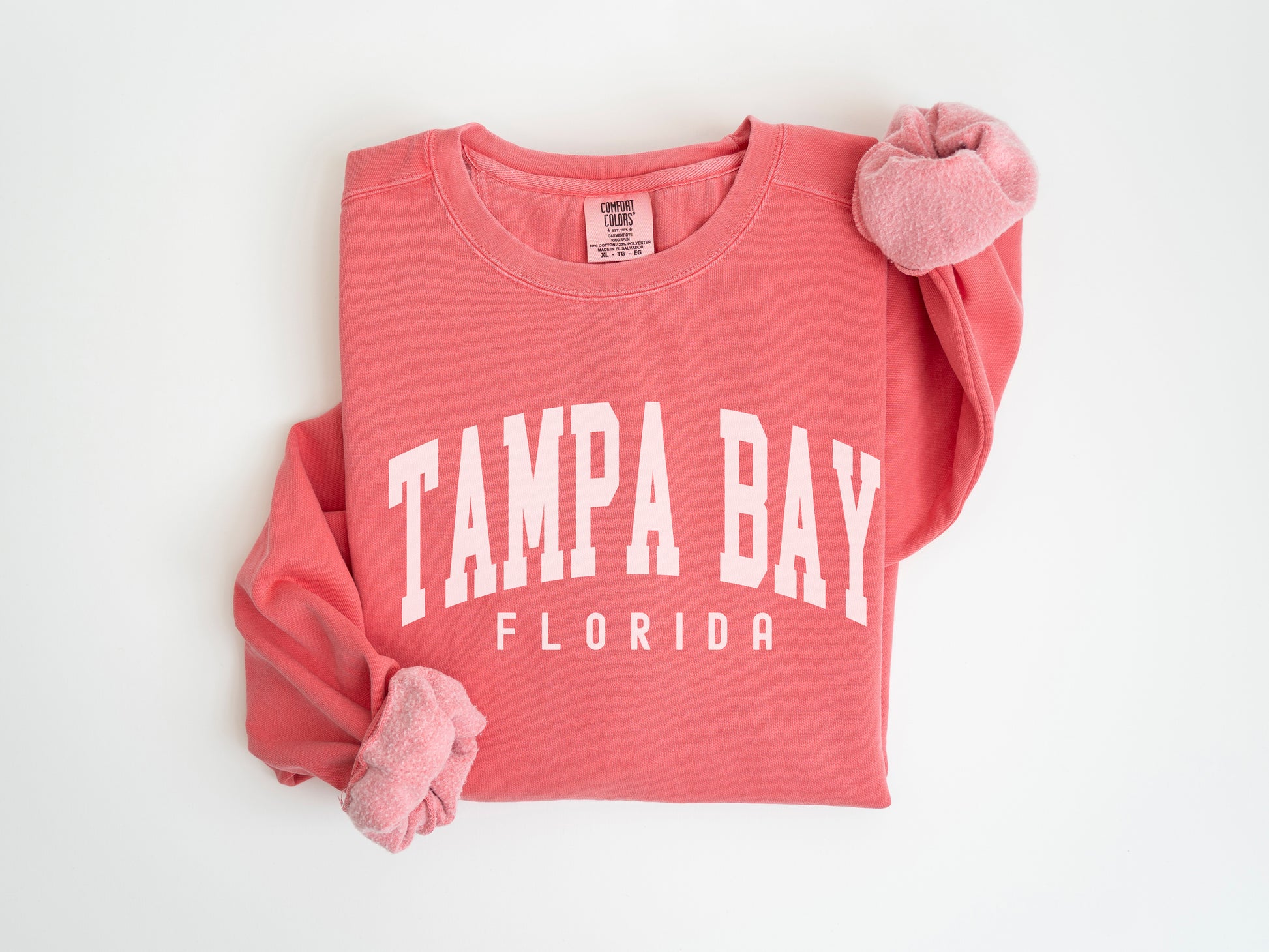 a pink shirt with tampa bay written on it