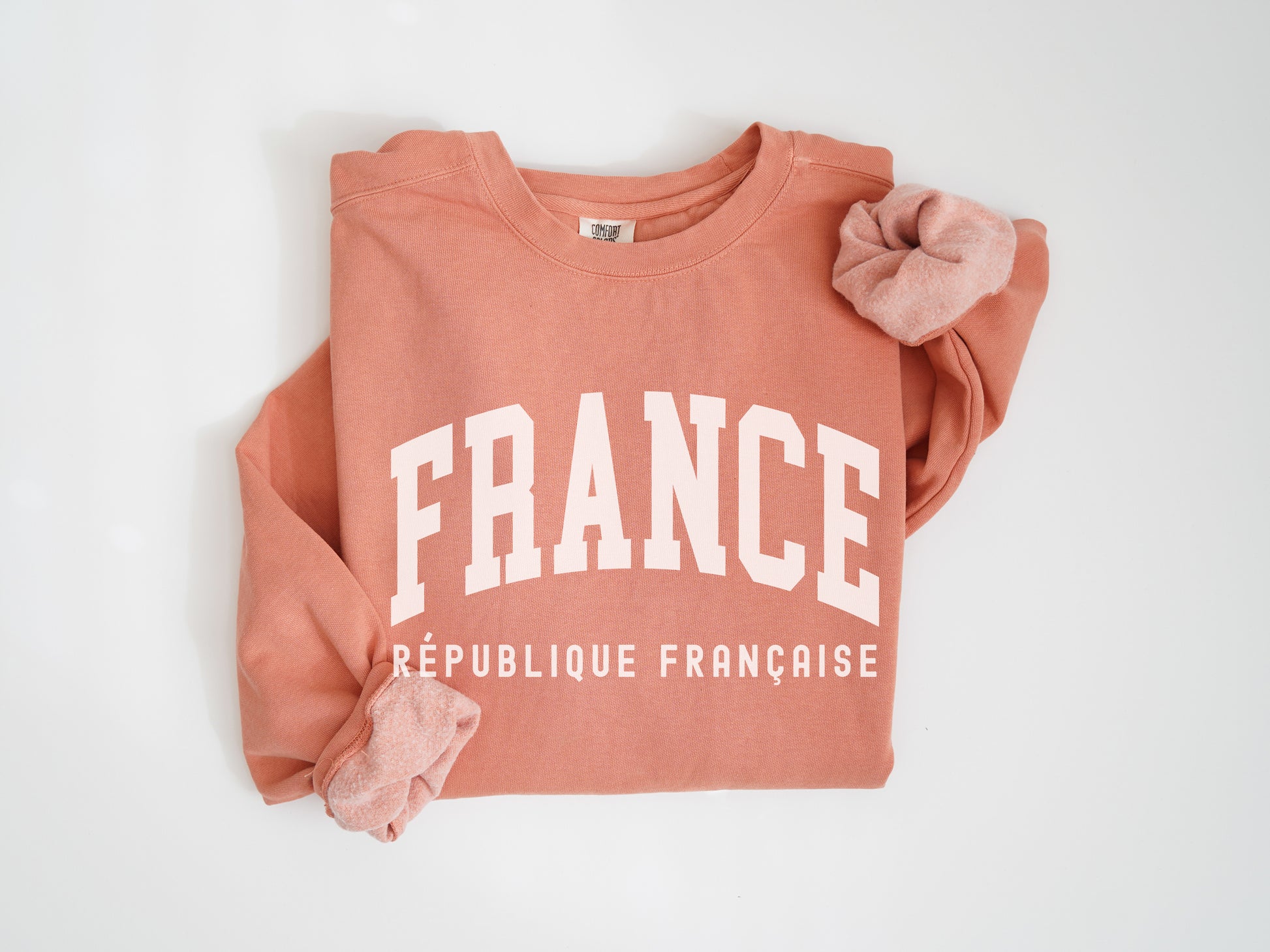 a pink sweatshirt with the word france printed on it