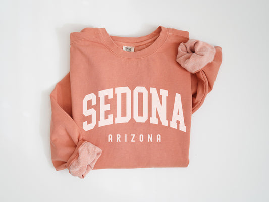 a red sweatshirt with the word sedona on it