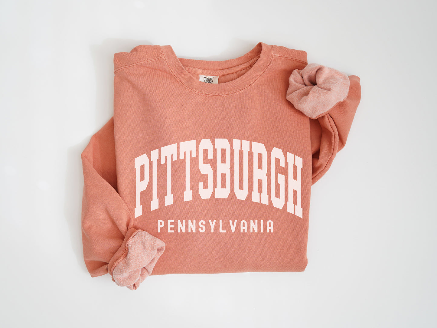 a pink sweatshirt with the words pittsburgh on it