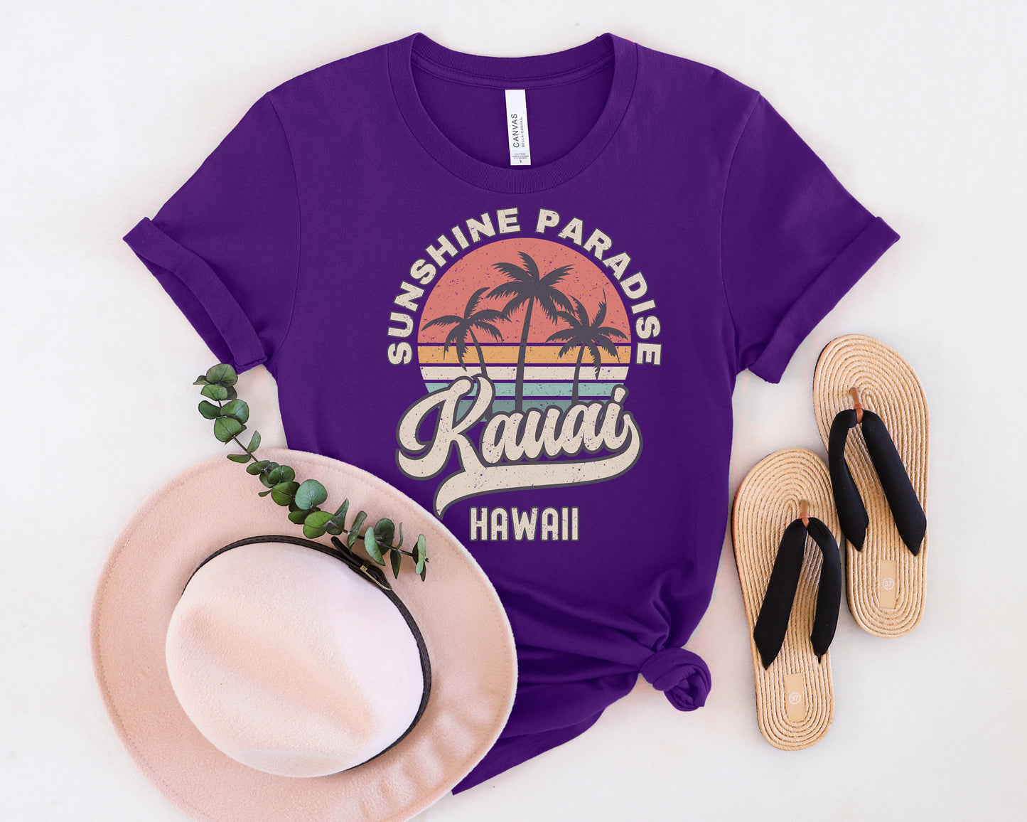 a purple shirt with the words sunshine paradise kaua'i on it