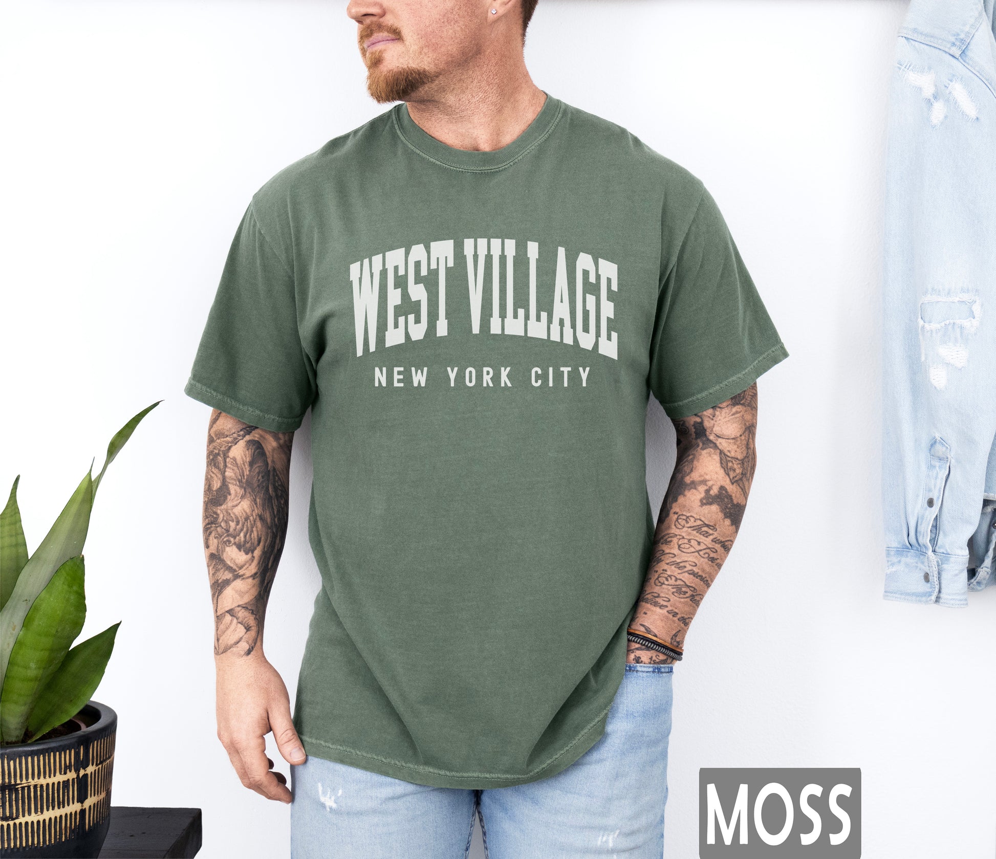 a man wearing a west village new york city t - shirt