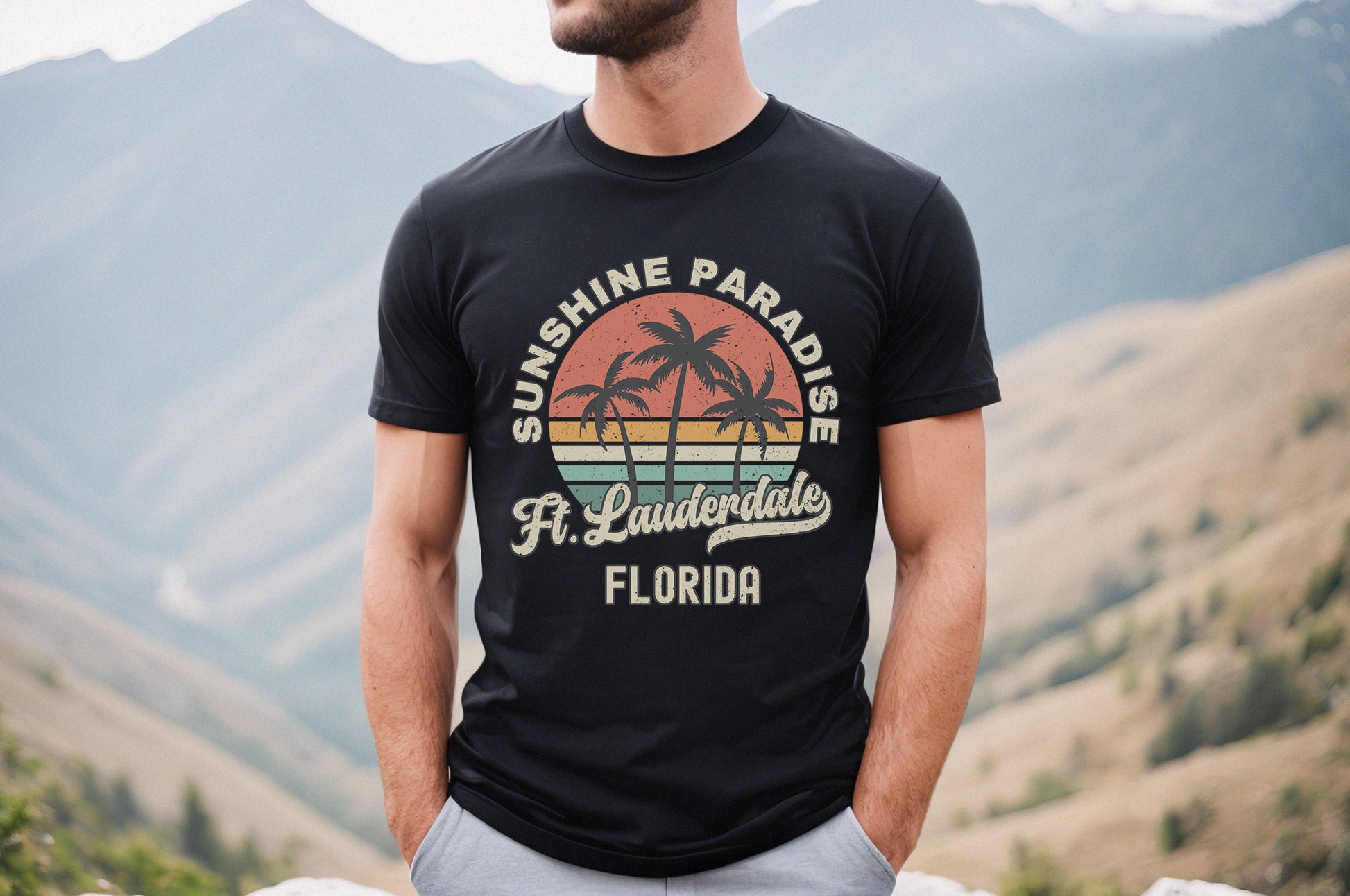 a man wearing a black shirt with a palm tree on it