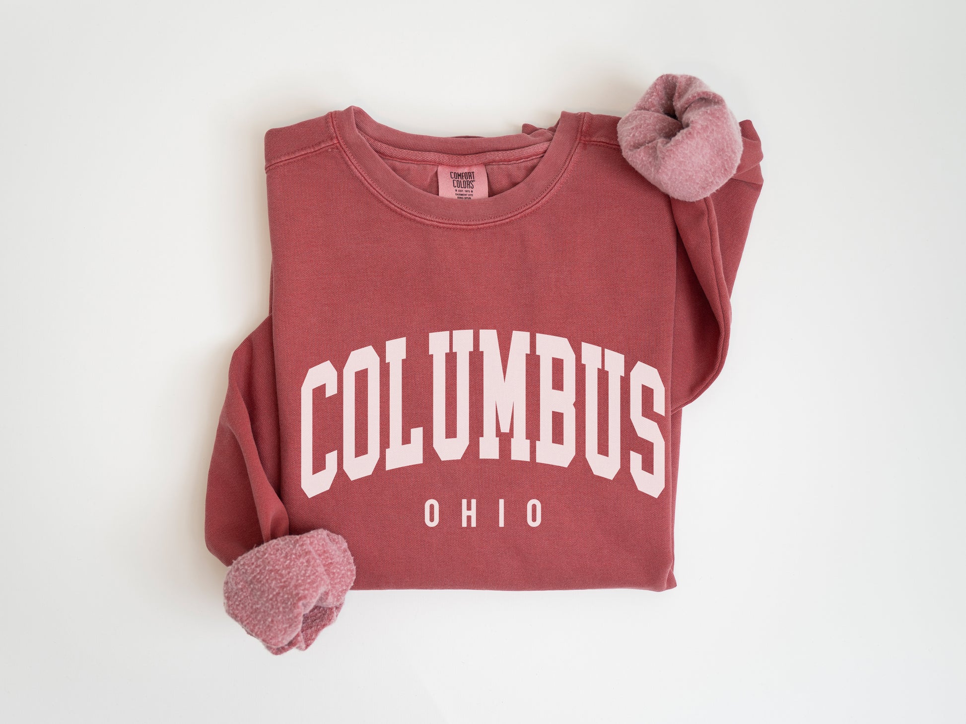 a red sweatshirt with the word columbus on it