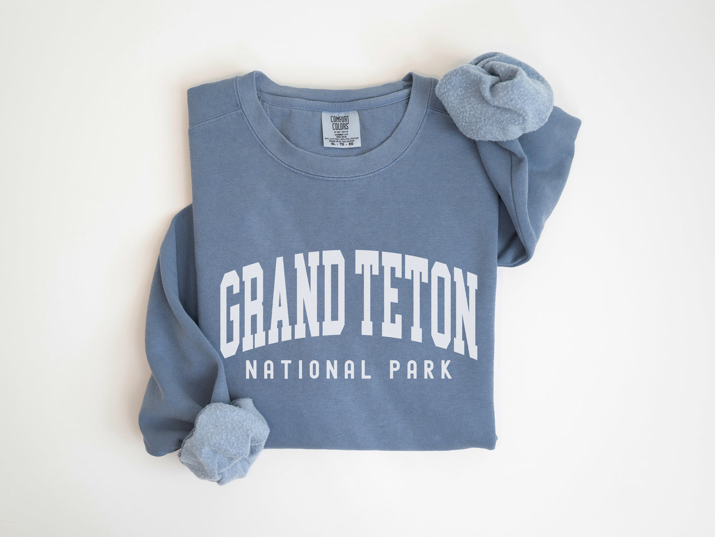 a blue shirt with the words grand teton national park on it