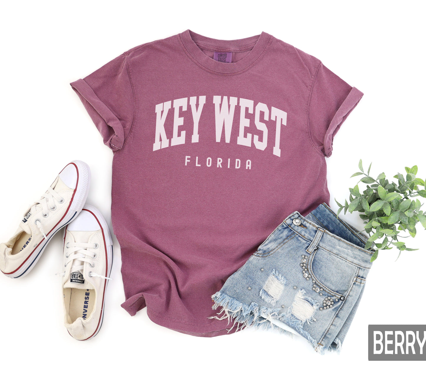 a t - shirt that says key west florida next to a pair of shorts