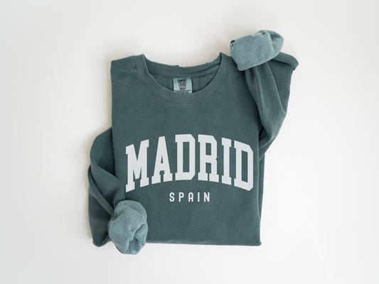 a green sweatshirt with the word madrid printed on it