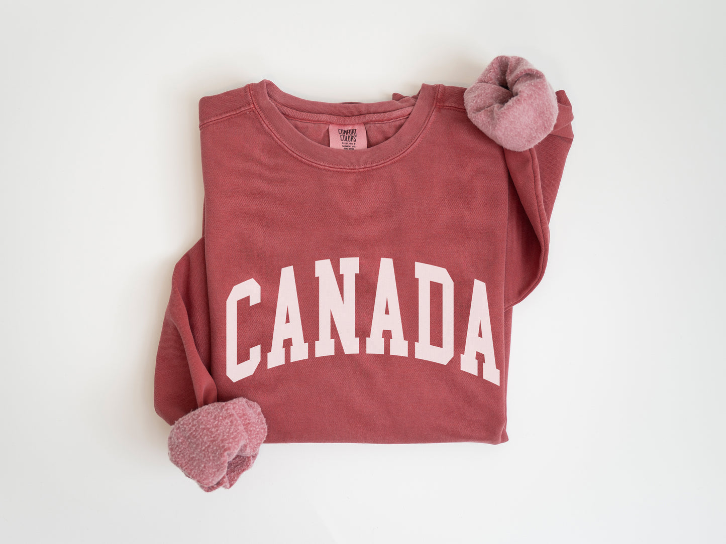 a red shirt with the word canada on it