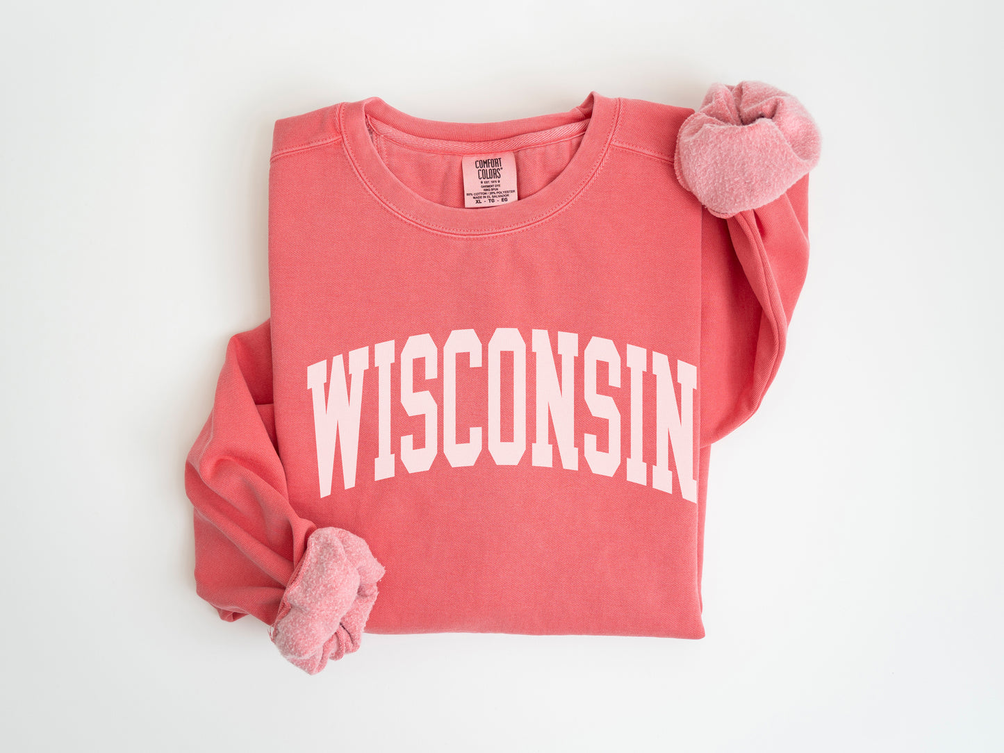 a red shirt with a white wisconsin on it