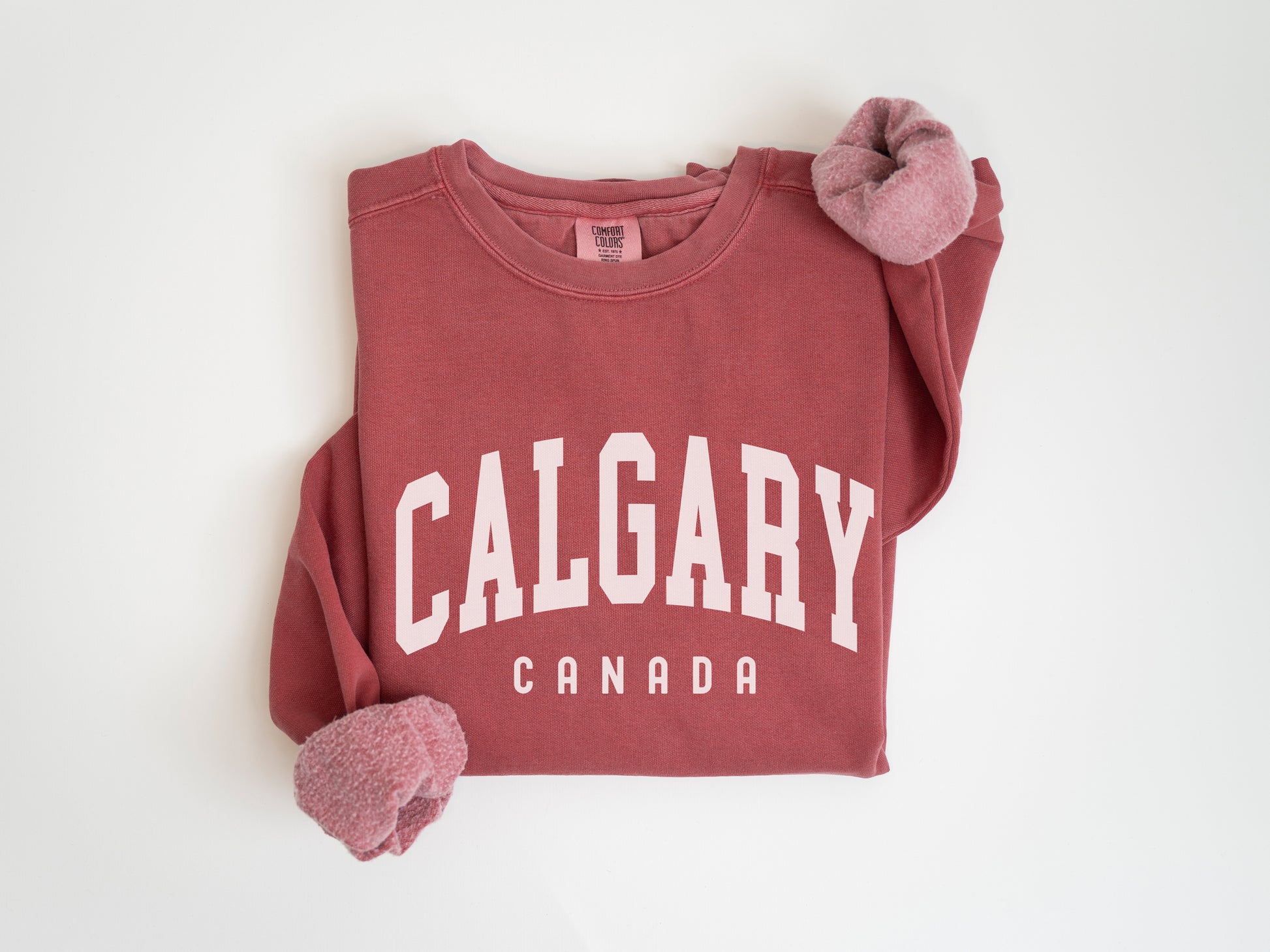 a red shirt with the word calgary on it