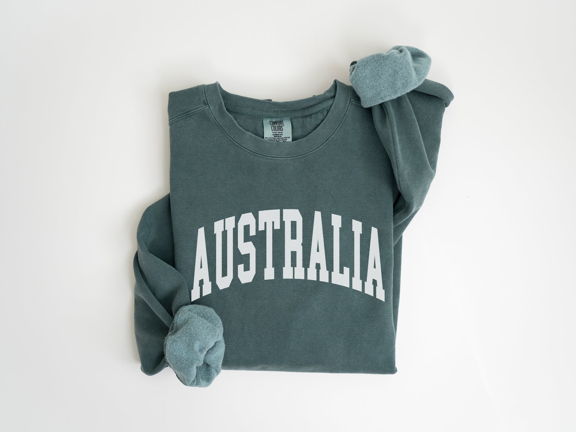 a green sweatshirt with the word australia printed on it