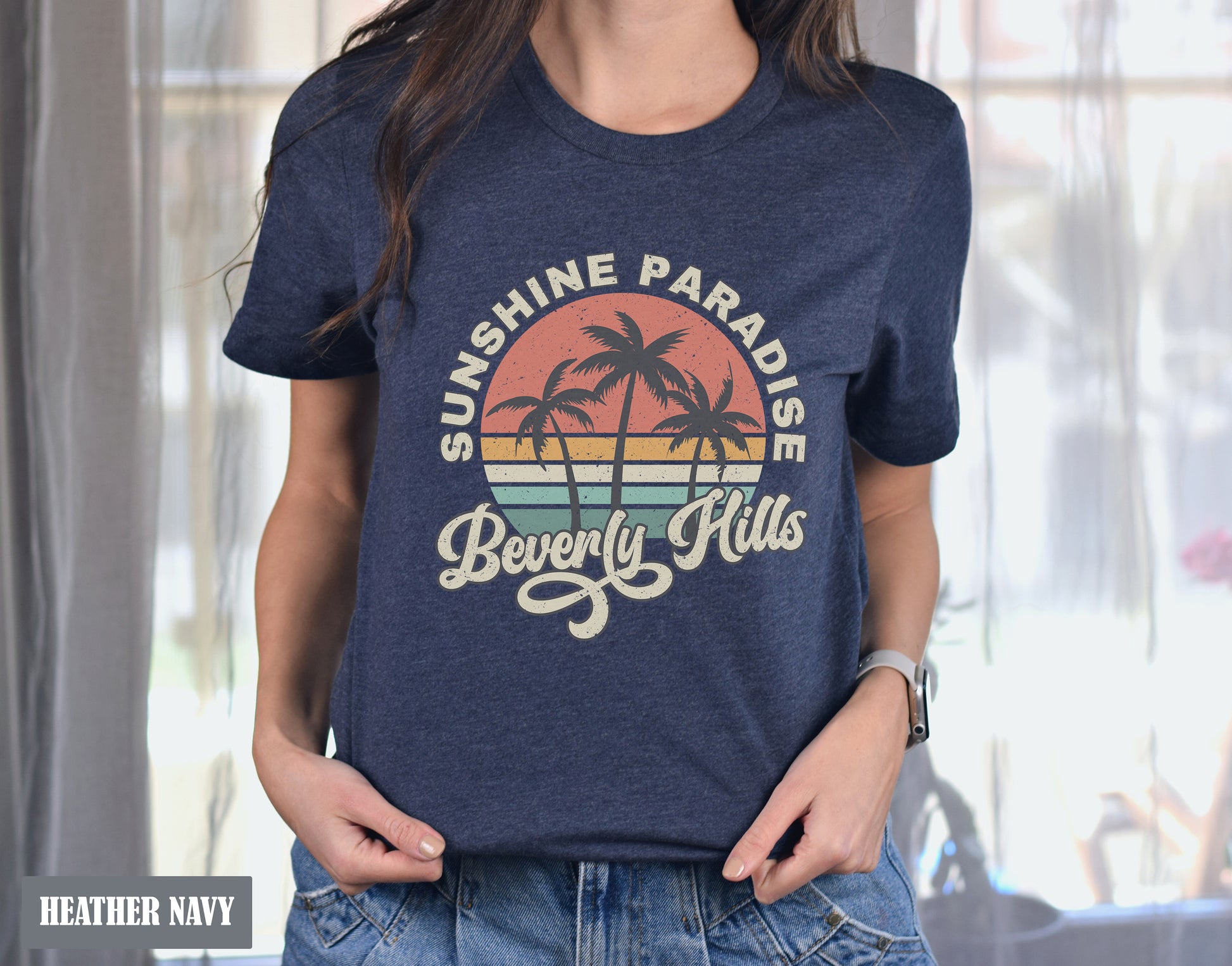 a woman wearing a t - shirt that says sunshine paradise beverly hills