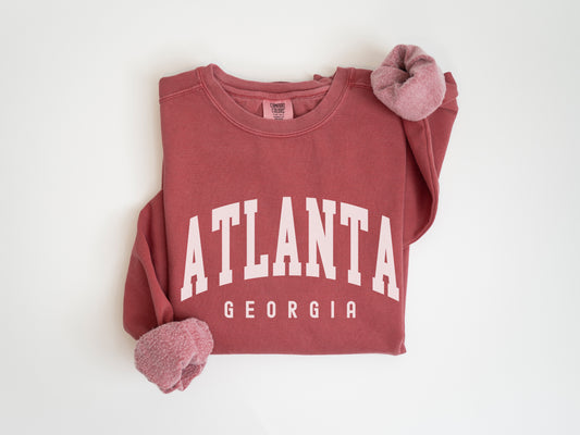 a red shirt with the word atlanta on it