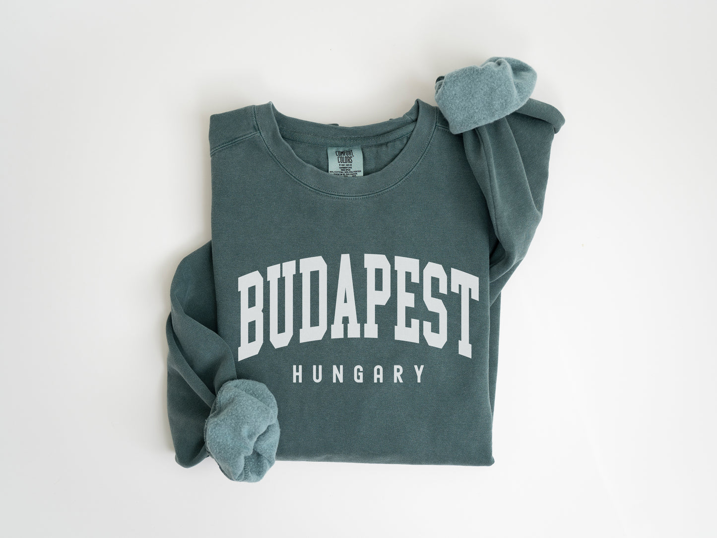 a green sweatshirt with the word budapest on it