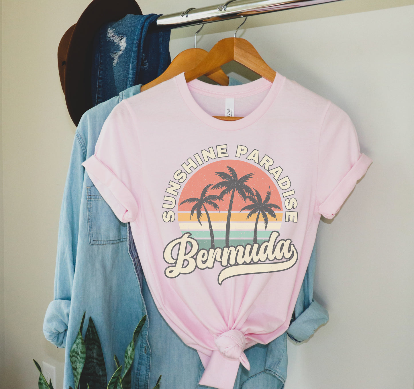 a pink shirt with a palm tree on it