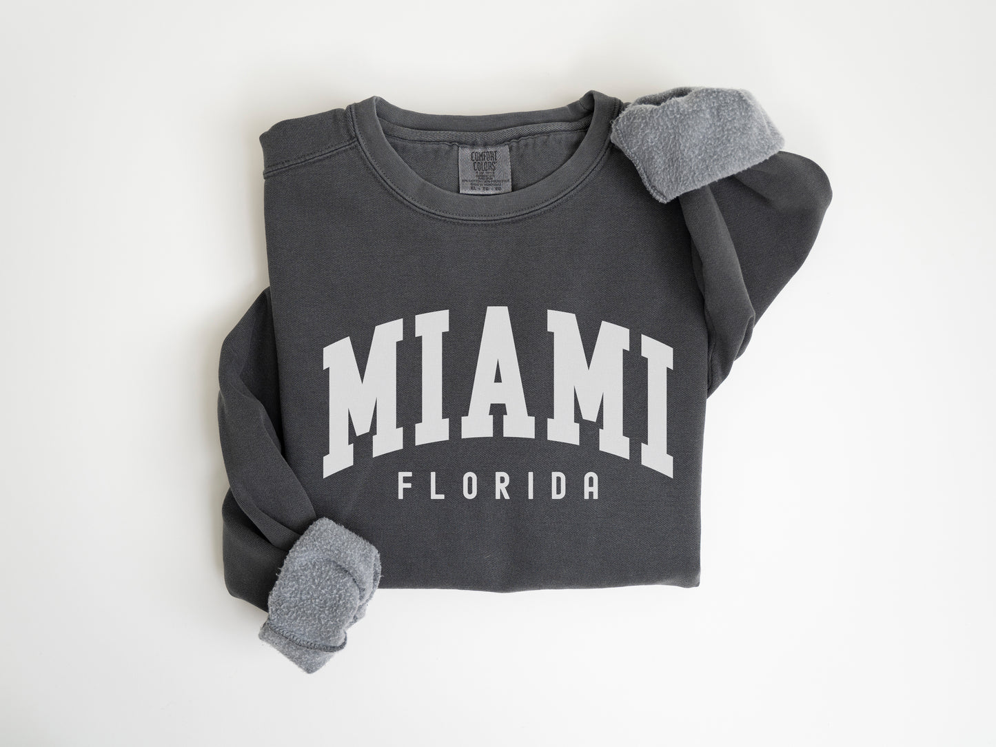 a gray sweatshirt with the word miami on it