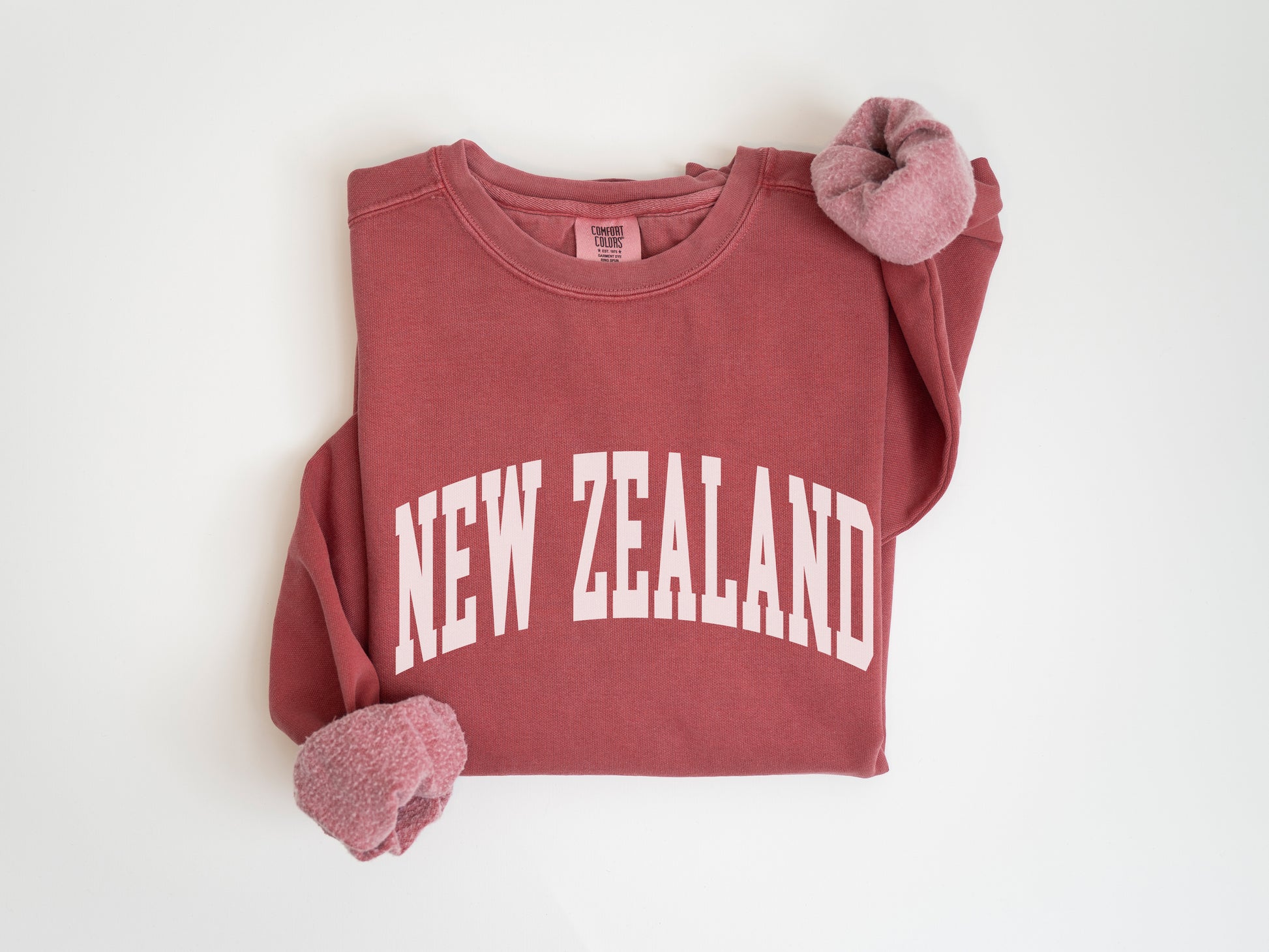 a red shirt with the word new zealand on it