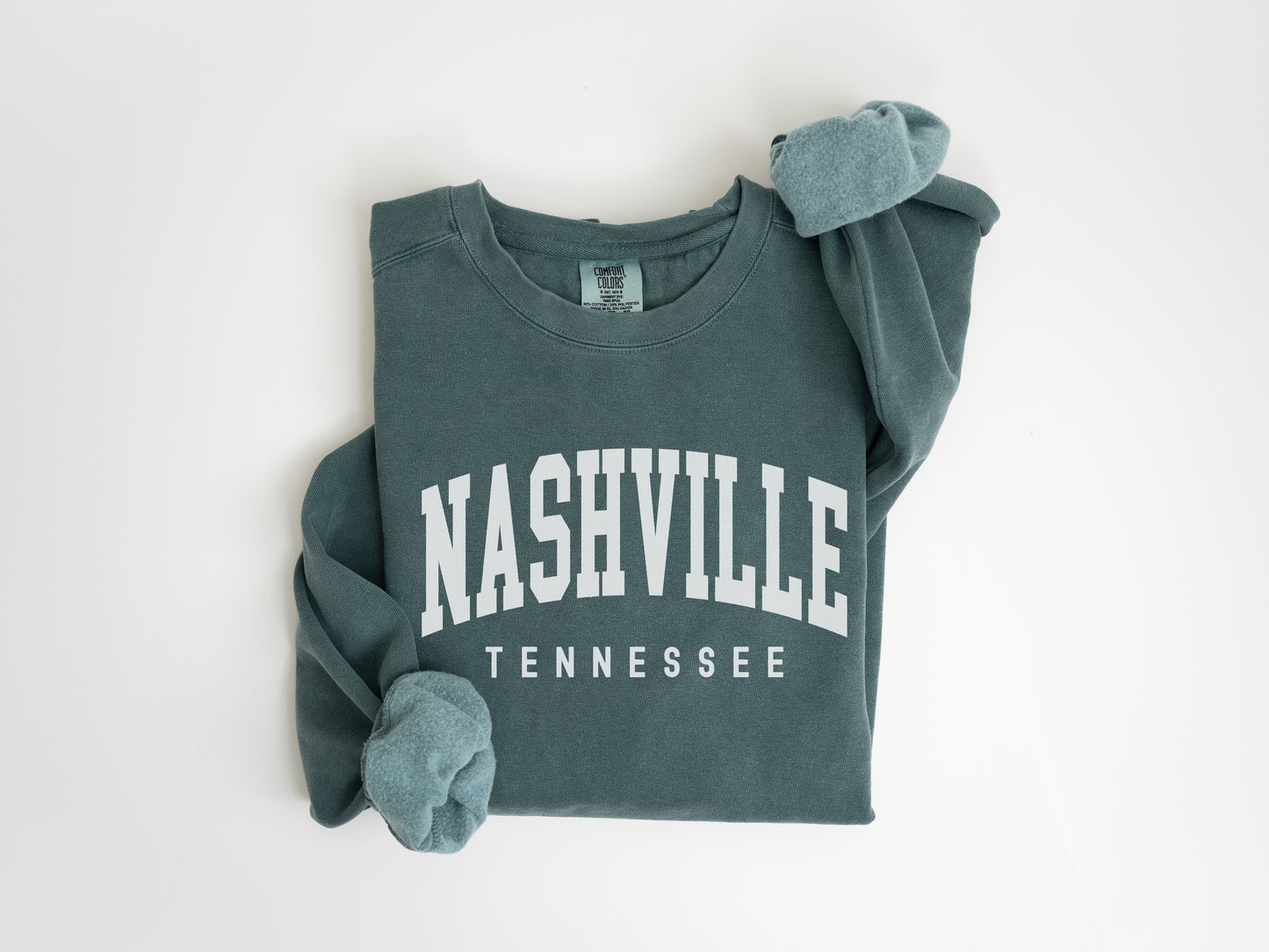 a green sweatshirt with the words nashville on it