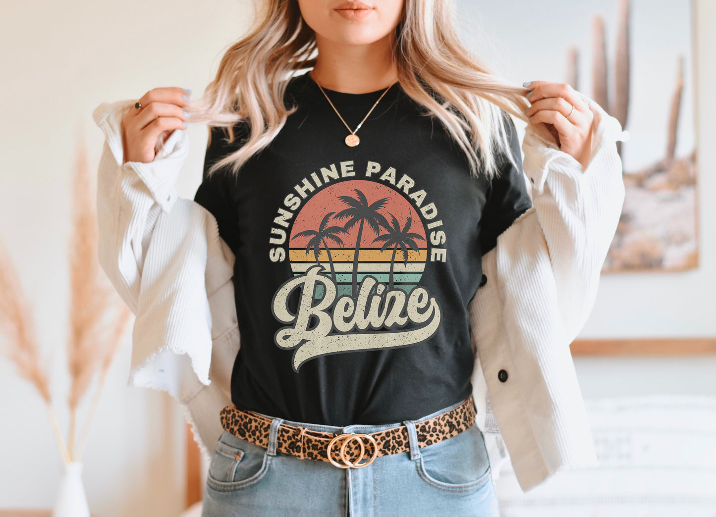 a woman wearing a black shirt with a palm tree on it