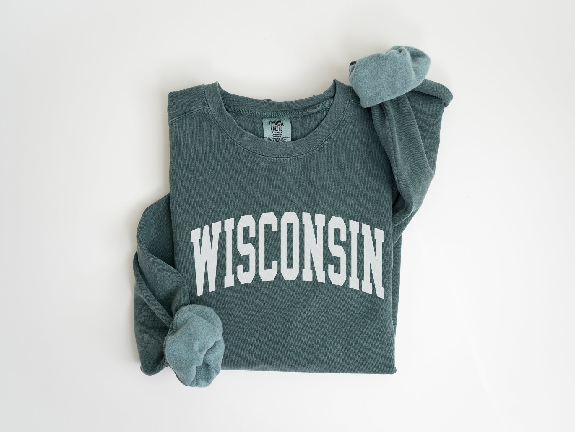 a green sweatshirt with the word wisconsin on it