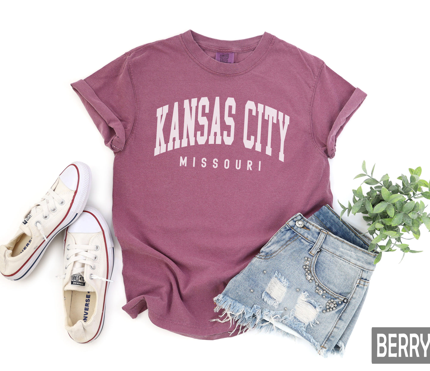 a shirt that says kansas city and a pair of shorts